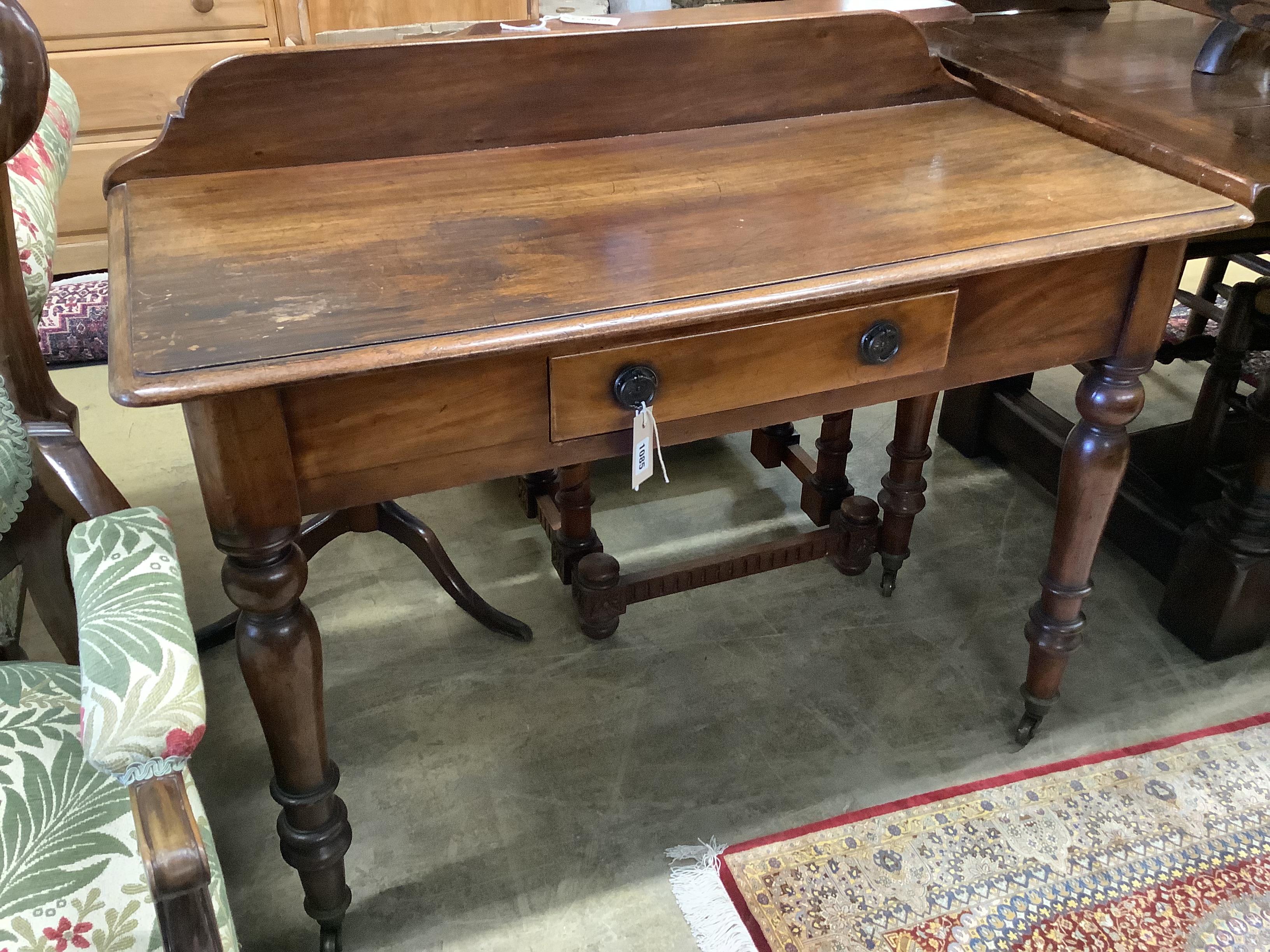 A Victorian mahogany writing table